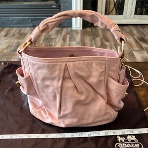 Coach leather pink handbag with duster bag